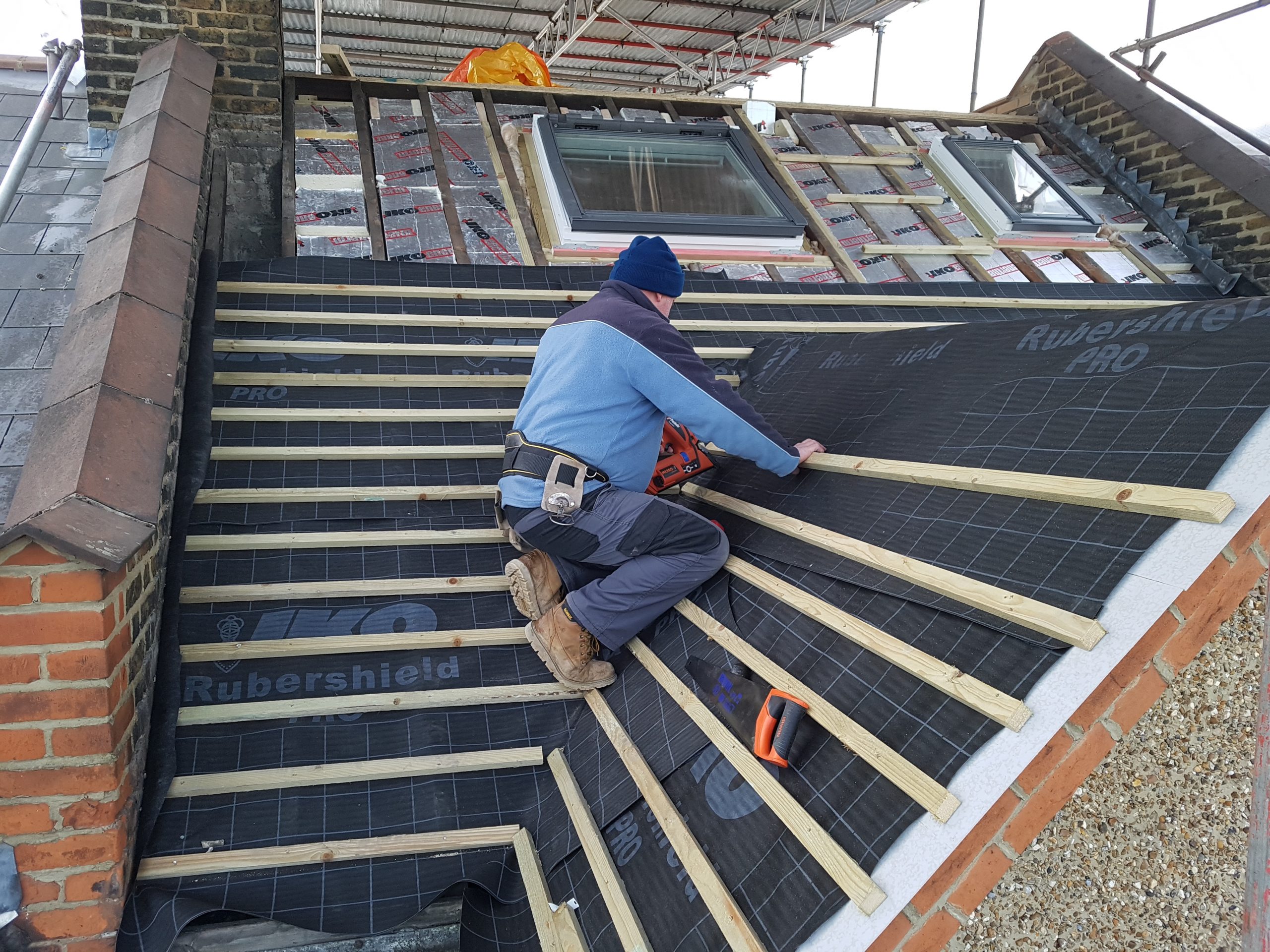 Felt and batten around velux